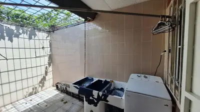 an empty kitchen with a stove and a window at Hidden House in Santa Ana