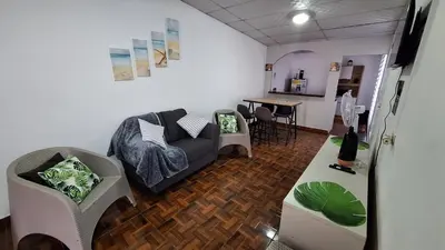 a living room with a couch and a table at Hidden House in Santa Ana
