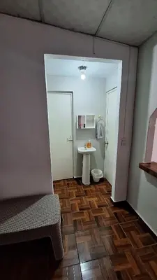 a room with a bathroom with a sink and a toilet at Hidden House in Santa Ana