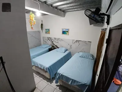 a room with two beds in a room at Hostal Santa Marta in La Unión