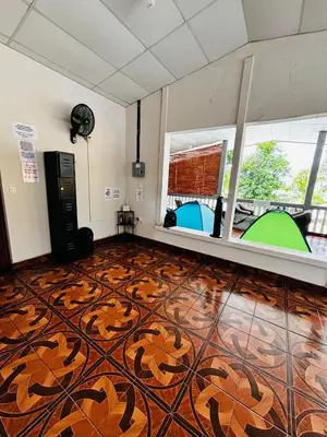 an empty room with a floor with a tiger pattern at LA CASONA SV Hostal in La Libertad