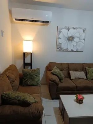 a living room with two couches and a table at House in San Miguel, Res. San Andres in San Miguel