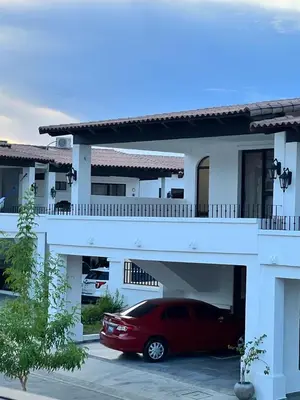 a red car parked in front of a building at House in San Miguel, Res. San Andres in San Miguel
