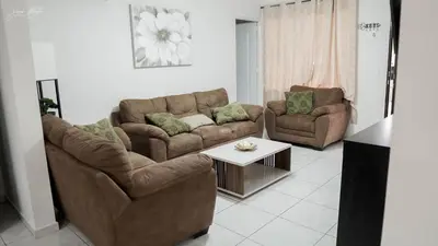 a living room with two couches and a coffee table at House in San Miguel, Res. San Andres in San Miguel