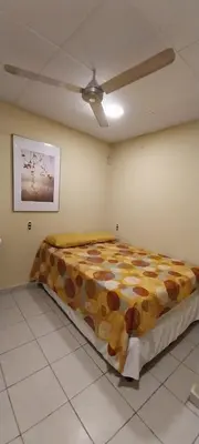a large bed in a room with a ceiling at Hostal San José in La Unión