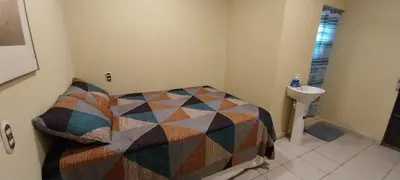 a small bedroom with a bed and a sink at Hostal San José in La Unión
