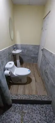 a bathroom with a sink and a toilet in it at Hostal San José in La Unión