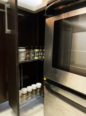 a kitchen with a refrigerator with white dishes in it at Encanto Urbano in San Salvador