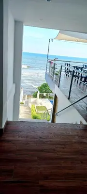 a room with a view of the ocean at KaiBlue Hotel y Restaurante in La Libertad