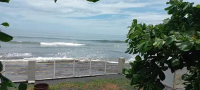 a view of the ocean from a fence at KaiBlue Hotel y Restaurante in La Libertad
