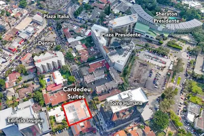 an overhead view of a city with buildings at Cardedeu Suites in San Salvador