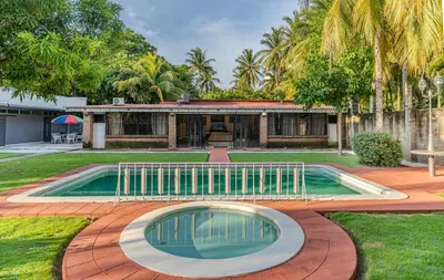 a house with a swimming pool in the yard at San Diego Beach House, near La Lib and Surf City in La Libertad