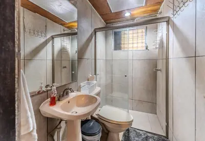 a bathroom with a sink and a toilet and a shower at San Diego Beach House, near La Lib and Surf City in La Libertad