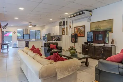 a living room with a couch and a table at San Diego Beach House, near La Lib and Surf City in La Libertad