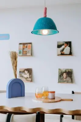 a dining room with a table with a blue light at ¡Sivar Sound! Music Design! in San Salvador