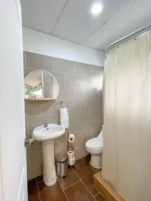 a bathroom with a sink and a toilet at Casa Serena B&B in Nueva San Salvador