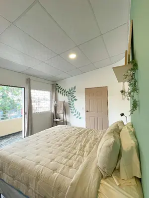 a bedroom with a large bed in a room at Casa Serena B&B in Nueva San Salvador