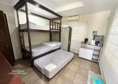 a room with two bunk beds in a room at Las Veraneras Villa - Pet Friendly in Acajutla