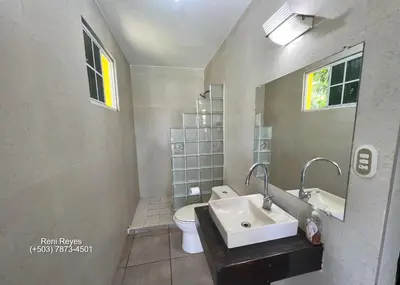 a bathroom with a sink and a toilet at Las Veraneras Villa - Pet Friendly in Acajutla