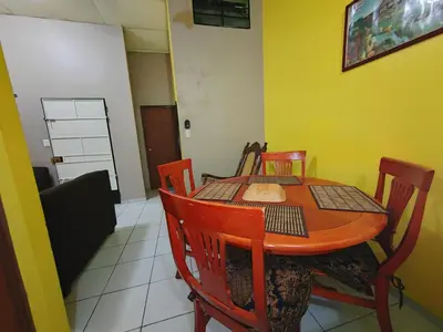 a dining room with a table and chairs at Hostal La Campana in San Miguel