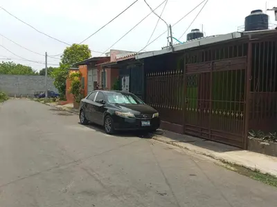 a black car parked on the side of a street at Hostal La Campana in San Miguel
