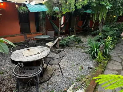 a table and two chairs and a table and a table and chairs at Casa isabel in Santa Ana