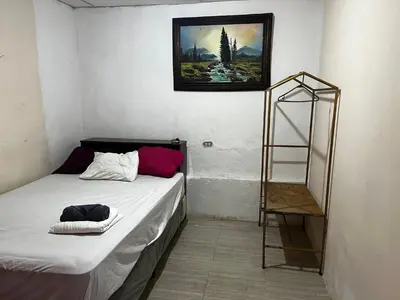 a small room with a bed and a ladder at Casa isabel in Santa Ana