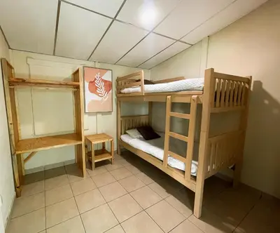 a room with two bunk beds in a room at Casa De Playa El Encanto in El Porvenir