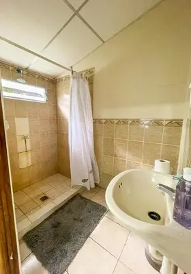 a bathroom with a tub and a sink and a shower at Casa De Playa El Encanto in El Porvenir