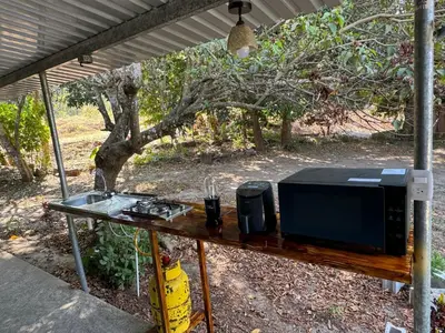 a microwave sitting on top of a table at El mangal B&B in Suchitoto