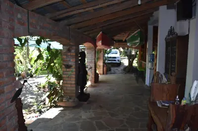 a brick hallway of a house with a brick wall at The Mayan Grouper in Suchitoto