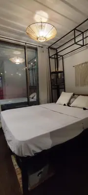 a large white bed in a room with mirrors at CASA V - Mizata in Santa María Mizata