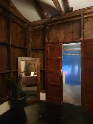 an open door in a room with a mirror at Bosko cerro verde in Lomas de San Marcelino