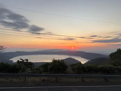 a sunset with a view of a body of water at Bosko cerro verde in Lomas de San Marcelino