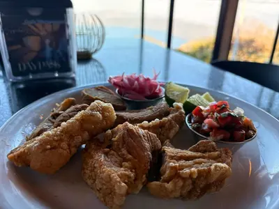 a plate of food with chicken and vegetables on a table at Bosko cerro verde in Lomas de San Marcelino