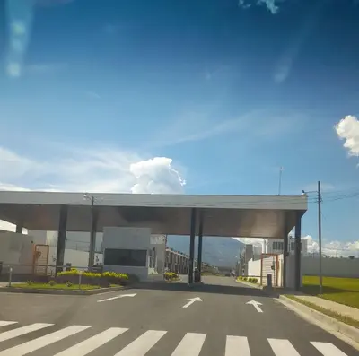 a gas station with a road in front of it at Casa flores Residencial Privada Nueva San miguel in San Miguel