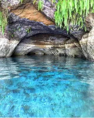 a body of water with a cave in it at Casa flores Residencial Privada Nueva San miguel in San Miguel