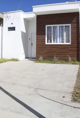 a house with a driveway in front of it at Casa flores Residencial Privada Nueva San miguel in San Miguel