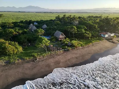 an aerial view of a resort on the beach at NAIA - Miravalle in Sonsonate