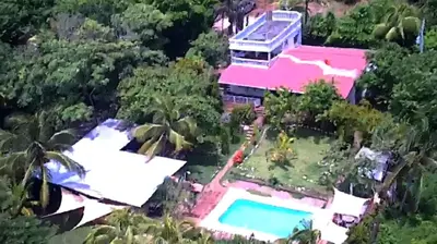 an aerial view of a house with a swimming pool at Jaco Mizata Beach and River in La Libertad