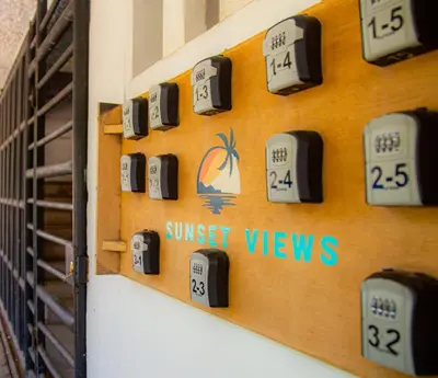 a wall of sun set views signs on a wall at Sunset View - Mini Loft in La Libertad