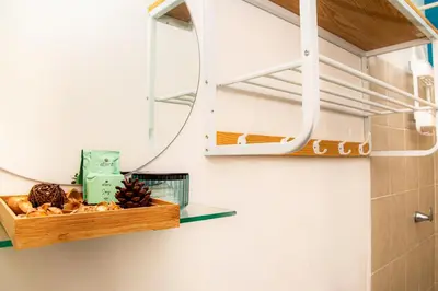 a mirror and a shelf with some food on it at Sunset View - Mini Loft in La Libertad