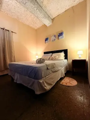 a bedroom with a large bed in a room at Sunset Views - Acogedor con vista al mar in La Libertad