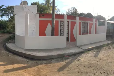 a building with white and red paint on it at Casa Topacio 1 in Santa Ana