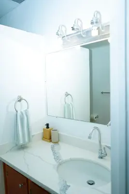 a bathroom with a sink and a mirror at Buena Vista El Zonte in El Zonte