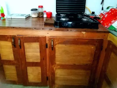 a kitchen counter with a microwave on top of it at costa azul apartment el zonte in La Libertad