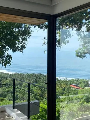 a window view of the ocean from a house at Eco Sky Villas in El Sunzal