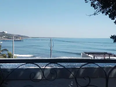 a view of the ocean from a balcony at Chilamar Surf Lodge in La Libertad