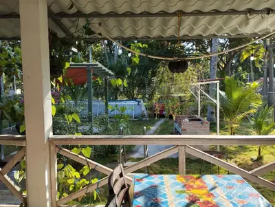 a view of a garden from a porch at Casa Jaragua in Barra de Santiago