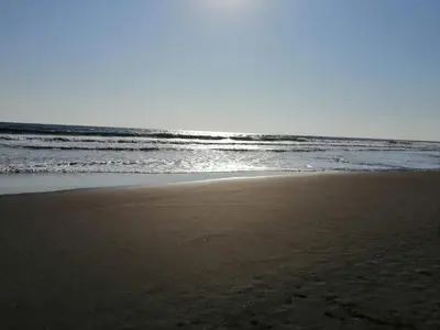 an empty beach with the ocean in the background at Casa Jaragua in Barra de Santiago